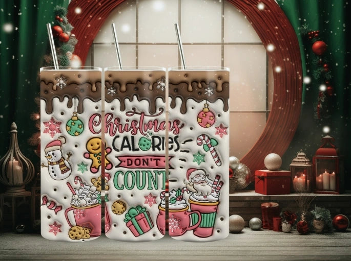 20 oz Christmas tumbler with festive design, snowman, Santa Claus, hot chocolate mugs, cookies, and the phrase Christmas Calories Don’t Count. Perfect reusable holiday cup gift.